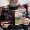 Jock reading THE BIKER GUIDE booklet at Bikers Cove, South Queensferry, Sco